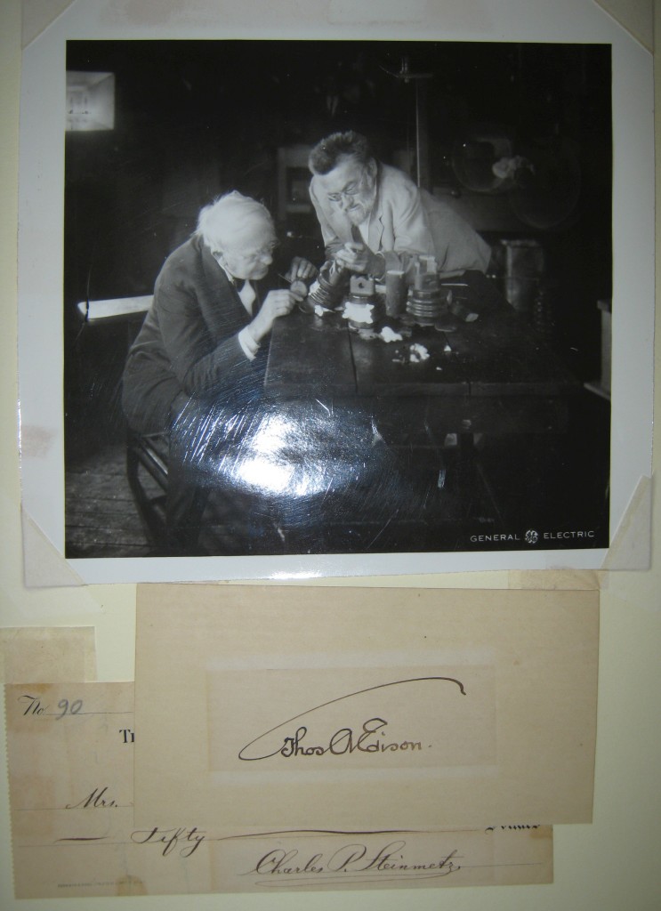 EDISON, THOMAS A.; AND CHARLES P. STEINMETZ. Two items: Edison. Signature, ThosAEdison, on a small slip of paper * Steinmetz. Check a